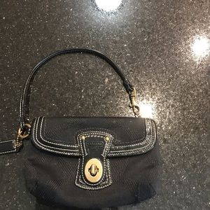A Coach Black wristlet